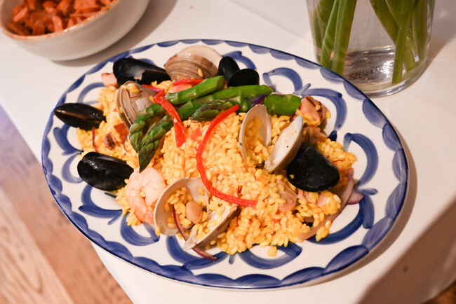 Paella with fresh ingredients prepared at a made to order action station